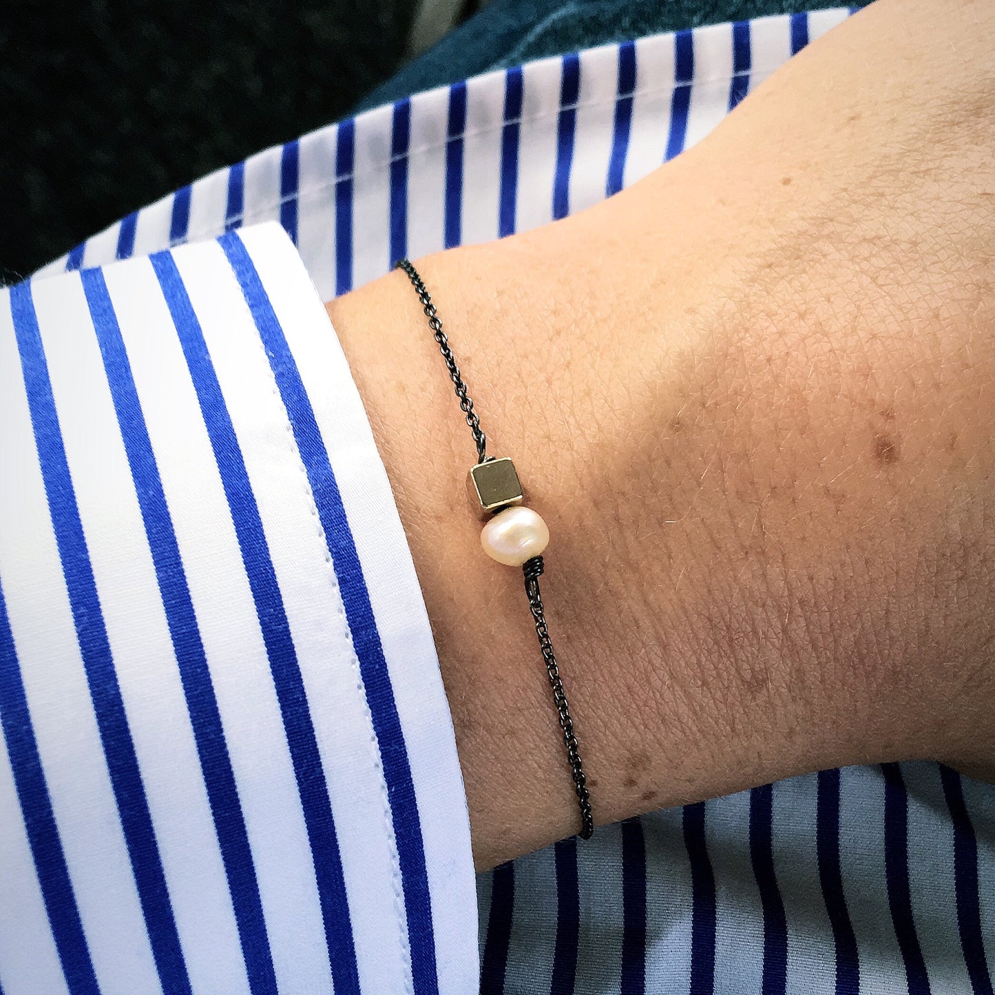 Armband schwarz gold Perle